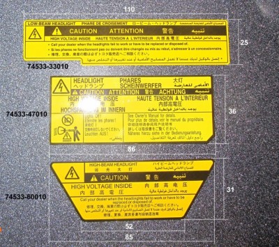 предупреждающие наклейки компании Toyota шильдики на ксенон-линзы.jpg